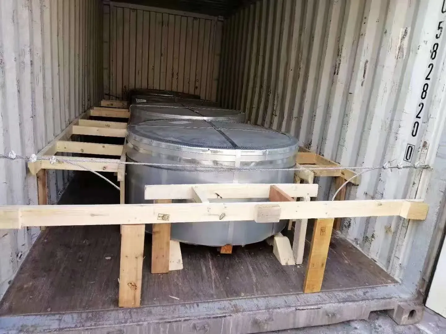 Stainless steel strip coils braced inside a shipping container