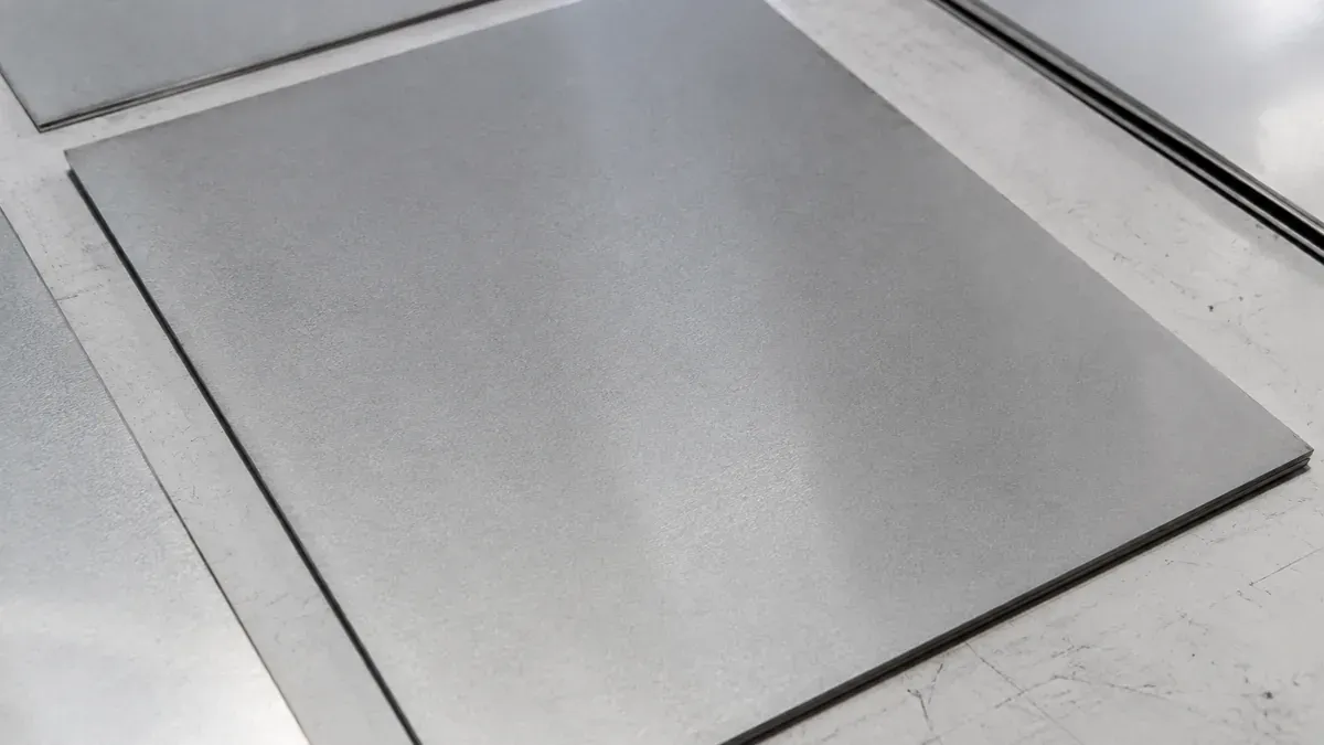 Illustrative 2B stainless steel sheet surface with smooth low-reflectivity mill finish