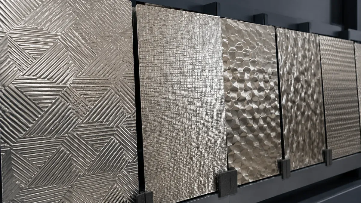 Illustrative embossed stainless steel sheet panels showing multiple raised patterns